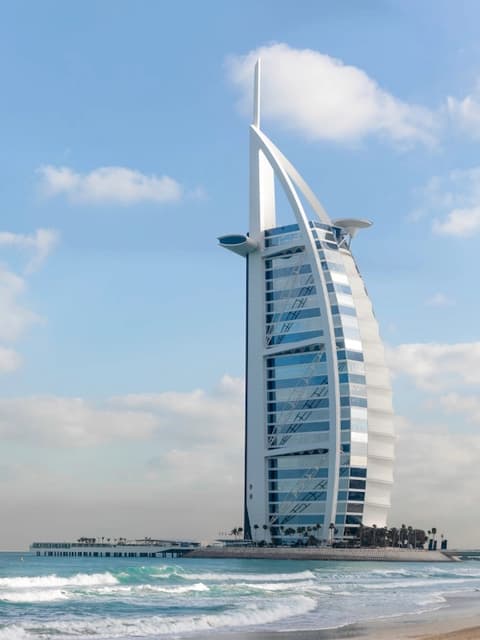The sail-shaped Burj Al Arab hotel rising above the Dubai shoreline