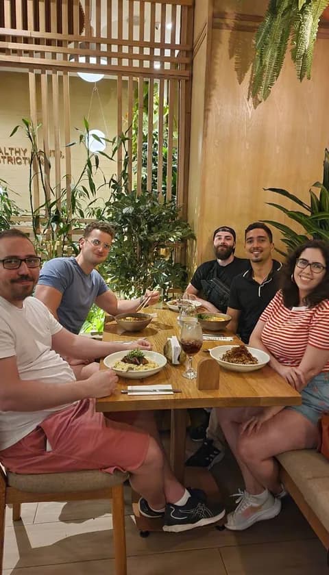 Free Cities community members gathered around a table at a local meetup
