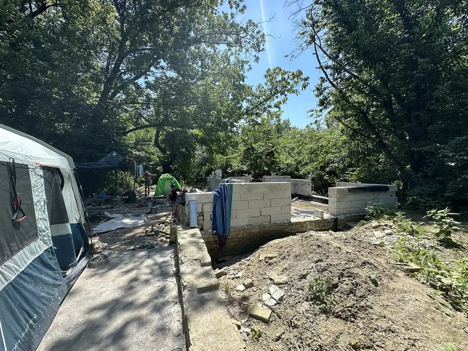 The walls of one of Liberland’s first houses going up beside the camp tents