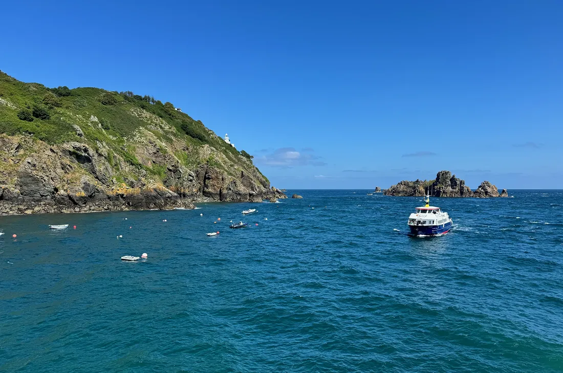 The Sark ferry approaching the island’s harbour beneath the lighthouse